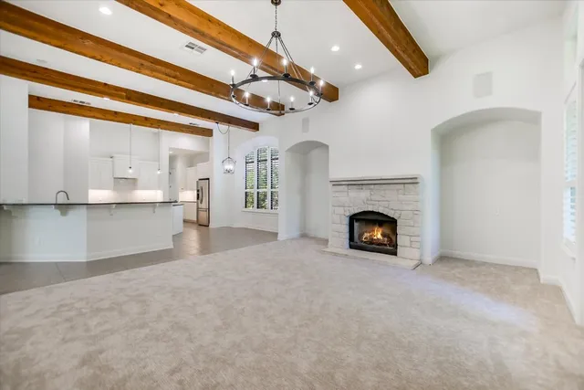 a view of a fireplace and window in a room