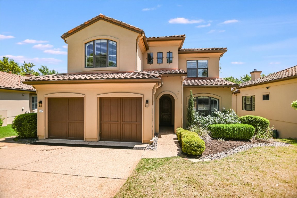 2617 University Club Drive Austin, TX 78732 - Photo 21 of 25 a front view of a house with a yard