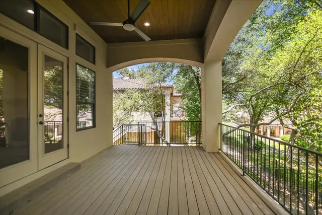 a view of a balcony with wooden floor