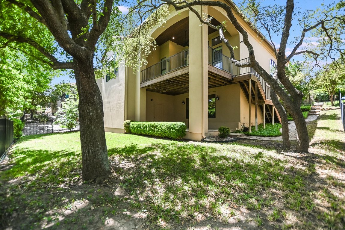 2617 University Club Drive Austin, TX 78732 - Photo 25 of 25 a view of a house with a tree in the yard