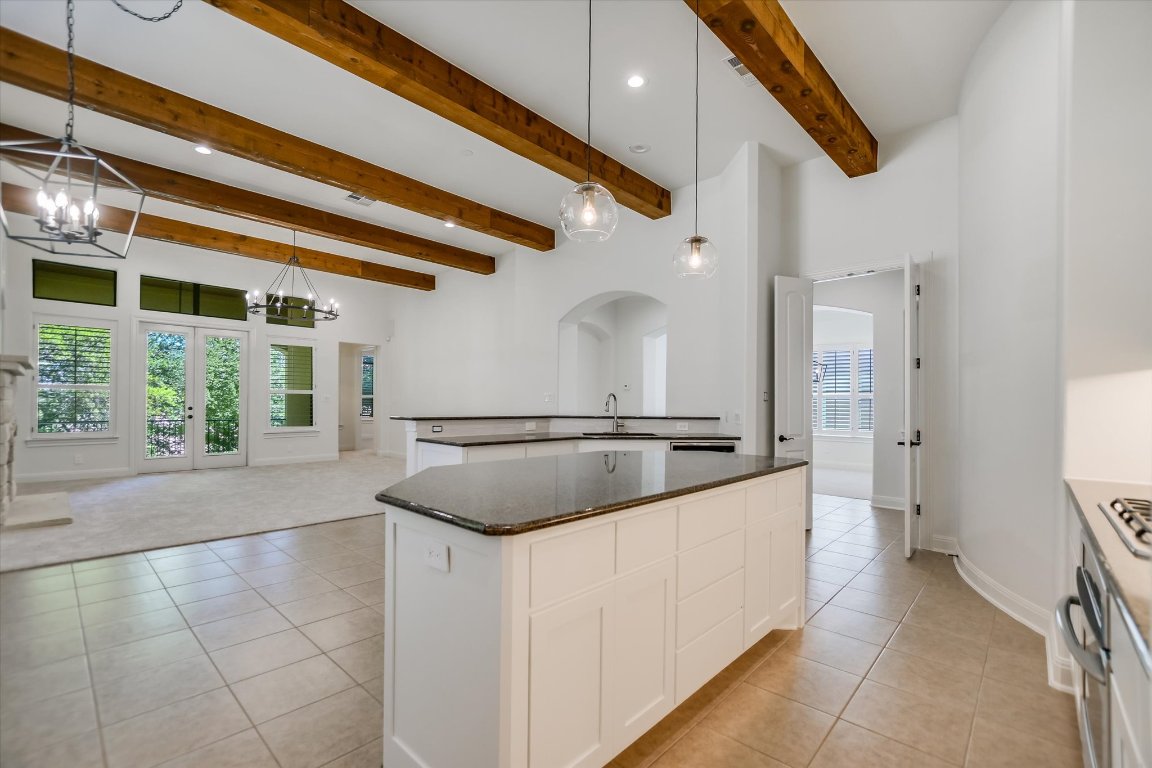 2617 University Club Drive Austin, TX 78732 - Photo 5 of 25 a kitchen with stainless steel appliances granite countertop a sink and a stove