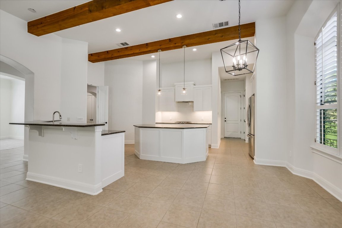 2617 University Club Drive Austin, TX 78732 - Photo 6 of 25 a large white kitchen with a large window