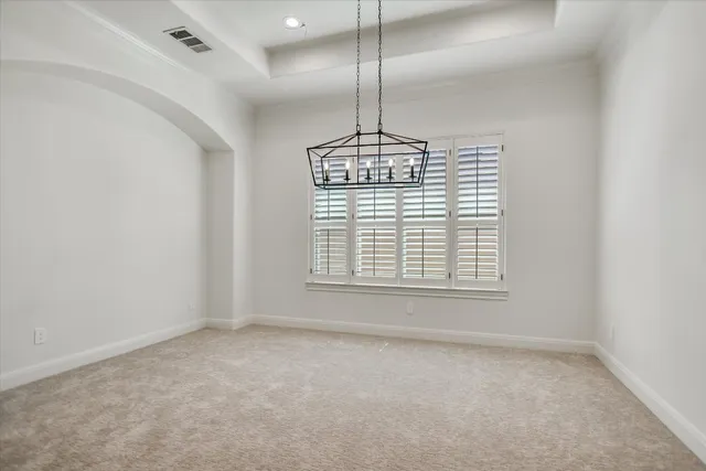 a view of wooden floor and windows in a room