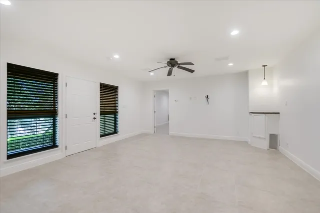 a view of an empty room with a fireplace