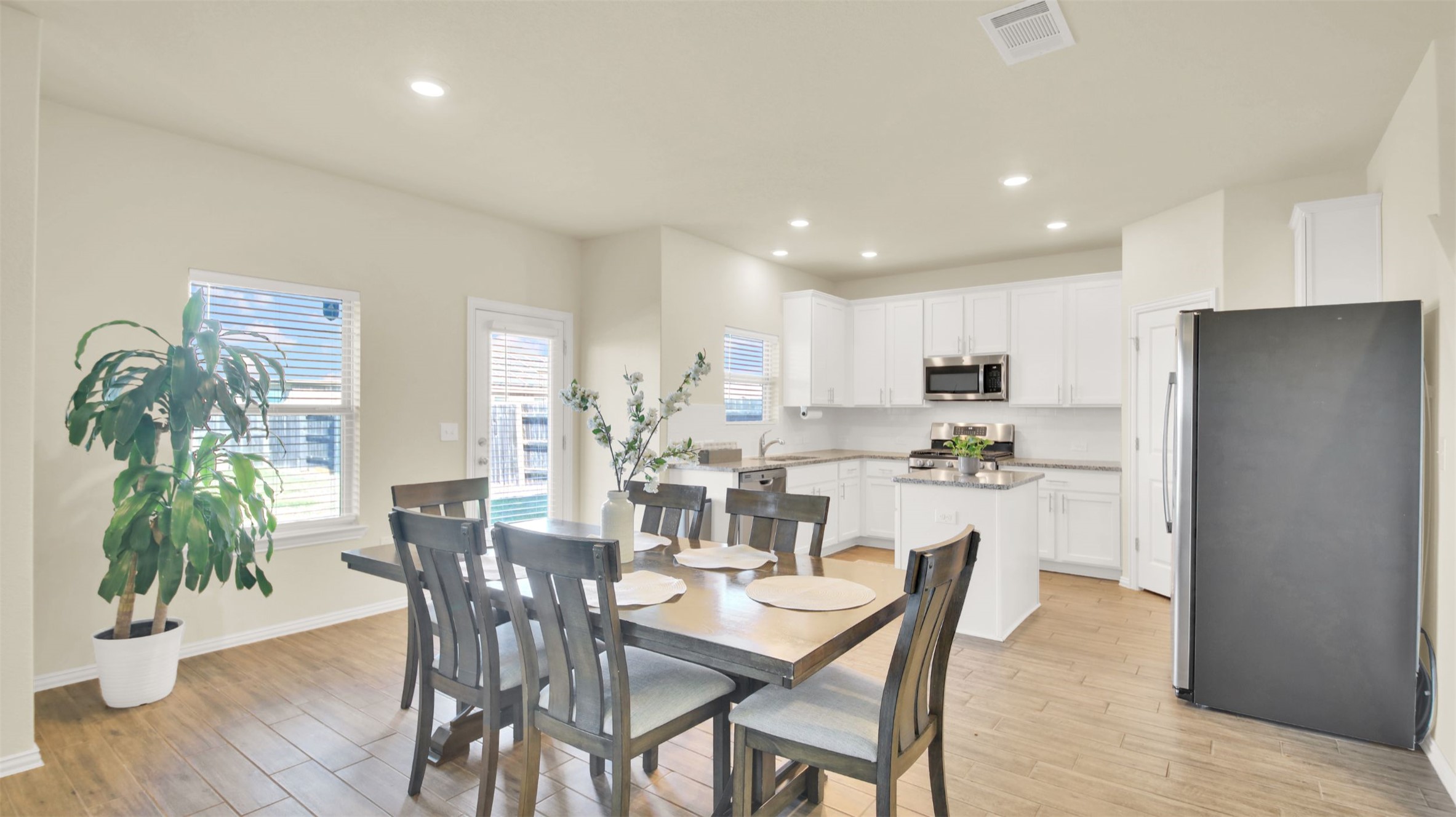 13716 Sugar Bush Path Manor, TX 78653 - Photo 20 of 37 Dining space with light wood-style floors and recessed lighting