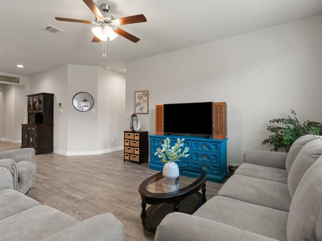 270 Lunayena Road Rhome, TX 76078 - Photo 25 of 37 The backyard offers a spacious outdoor setting with a covered patio, creating an ideal space for outdoor dining, relaxing, or entertaining while enjoying the open Texas landscape.