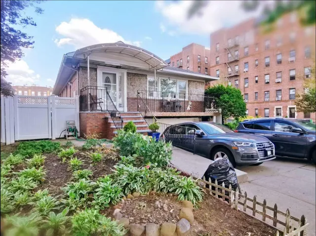 a front view of a house with garden