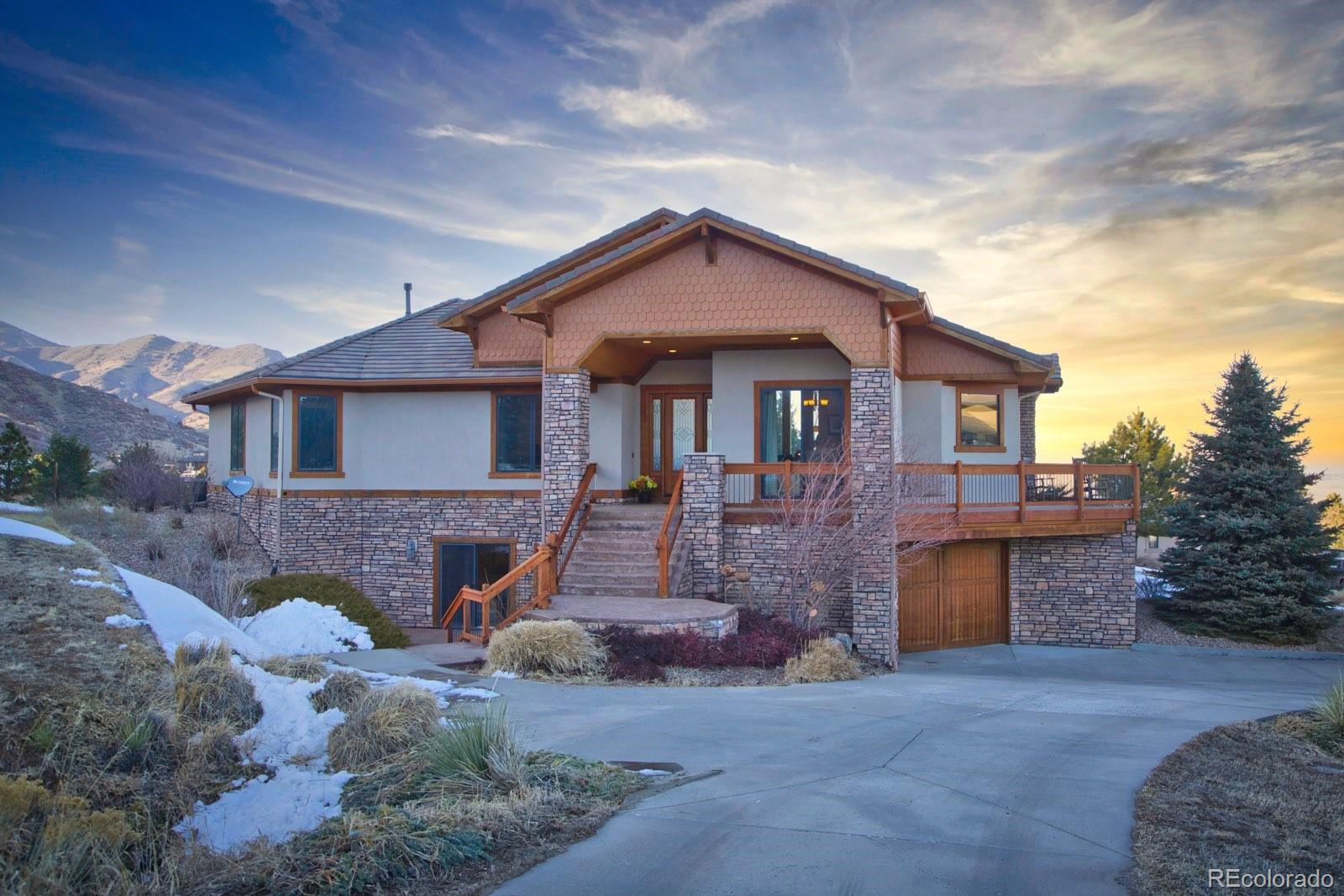 11227 Explorers Run Littleton, CO 80125 - Photo 1 of 33 a front view of a house with a garden
