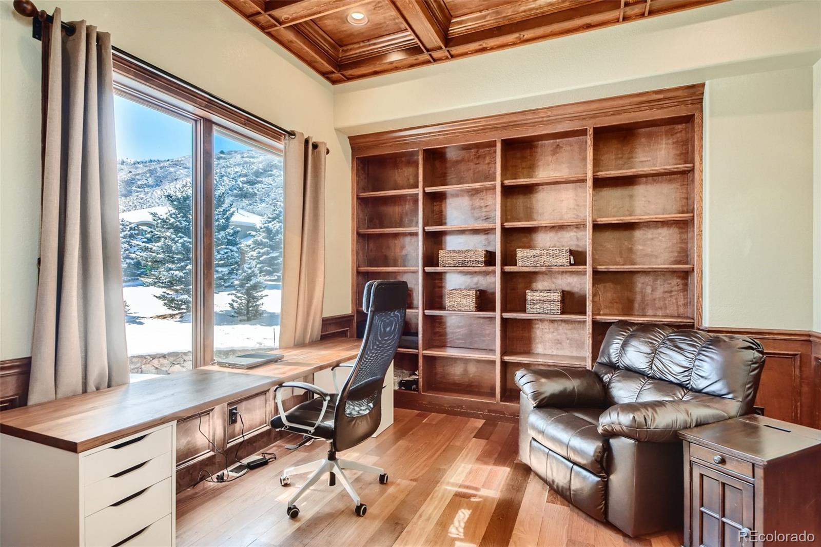 11227 Explorers Run Littleton, CO 80125 - Photo 14 of 33 a room with furniture and a window