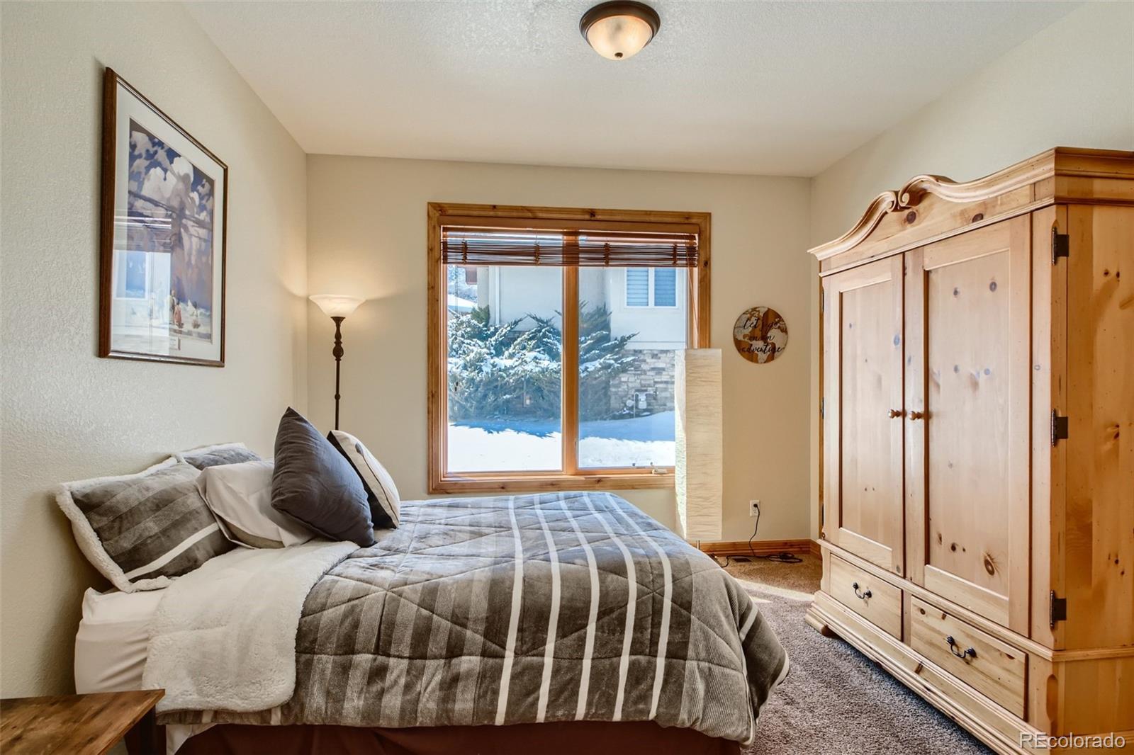 11227 Explorers Run Littleton, CO 80125 - Photo 21 of 33 a bedroom with a bed and a window