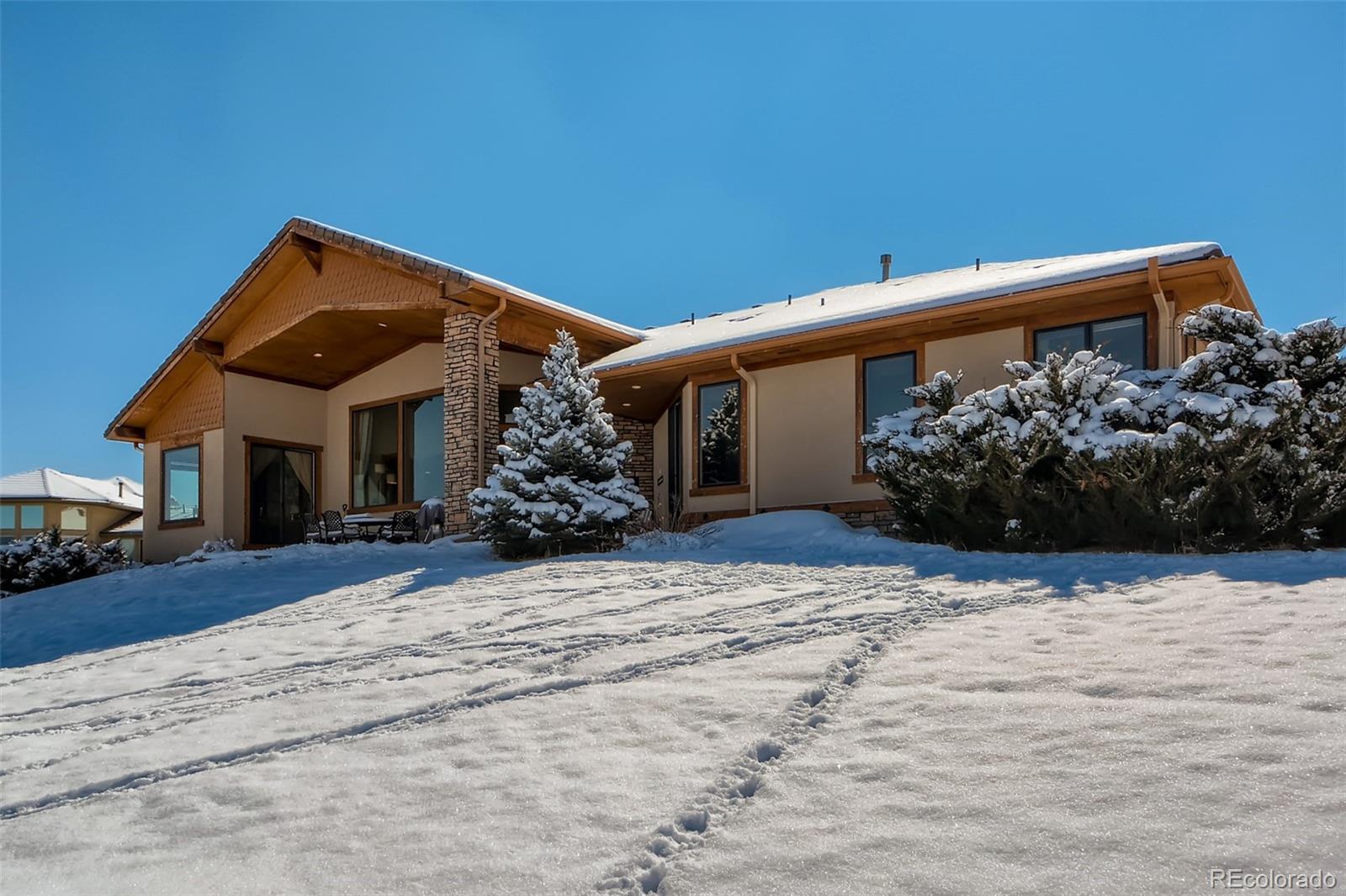 11227 Explorers Run Littleton, CO 80125 - Photo 30 of 33 a view of a house with a yard