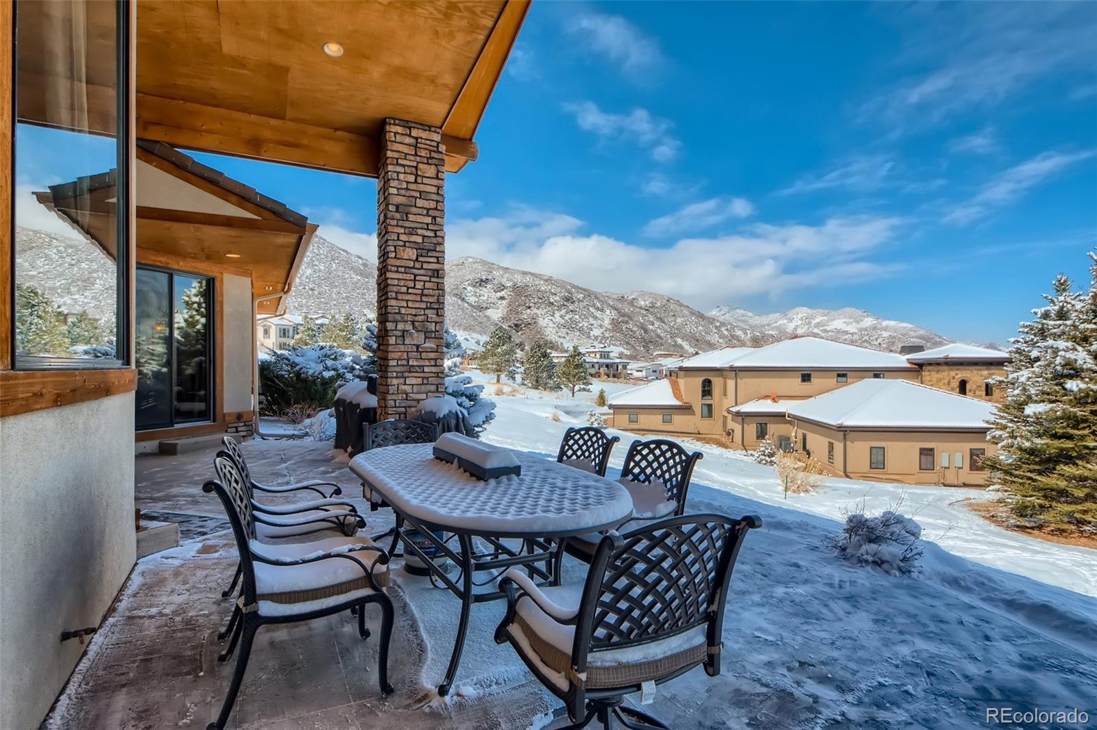11227 Explorers Run Littleton, CO 80125 - Photo 31 of 33 a view of a patio with a table and chairs