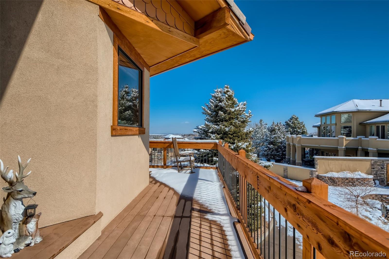 11227 Explorers Run Littleton, CO 80125 - Photo 32 of 33 a balcony with wooden floor and outdoor seating
