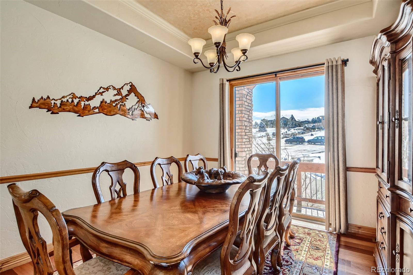 11227 Explorers Run Littleton, CO 80125 - Photo 8 of 33 a view of a dining room with furniture window and outside view