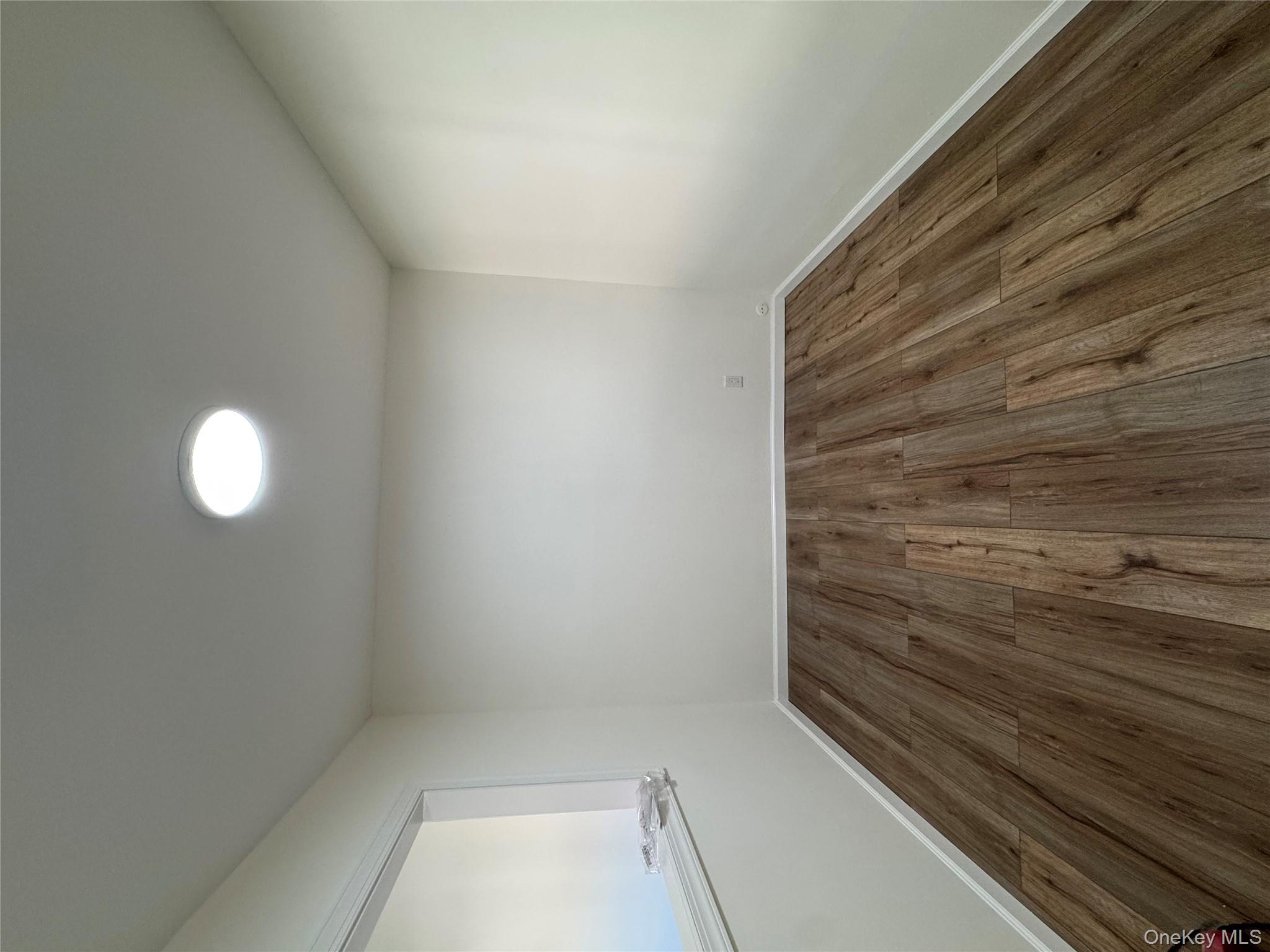 2449 I Union Avenue, Unit 34A Islip, NY 11751 - Photo 13 of 19 a view of wooden floor in a room