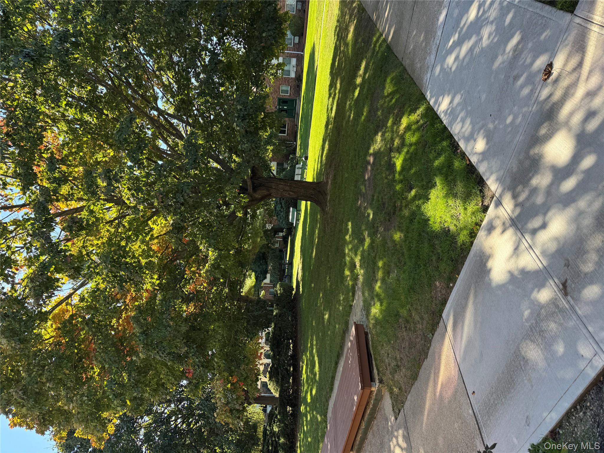 2449 I Union Avenue, Unit 34A Islip, NY 11751 - Photo 16 of 19 a view of a golf course with a lake