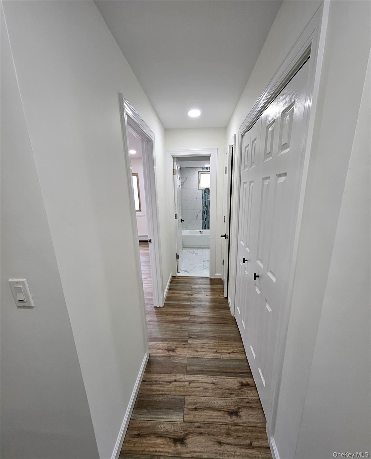 2449 I Union Avenue, Unit 34A Islip, NY 11751 - Photo 18 of 19 a view of a hallway with wooden floor and staircase