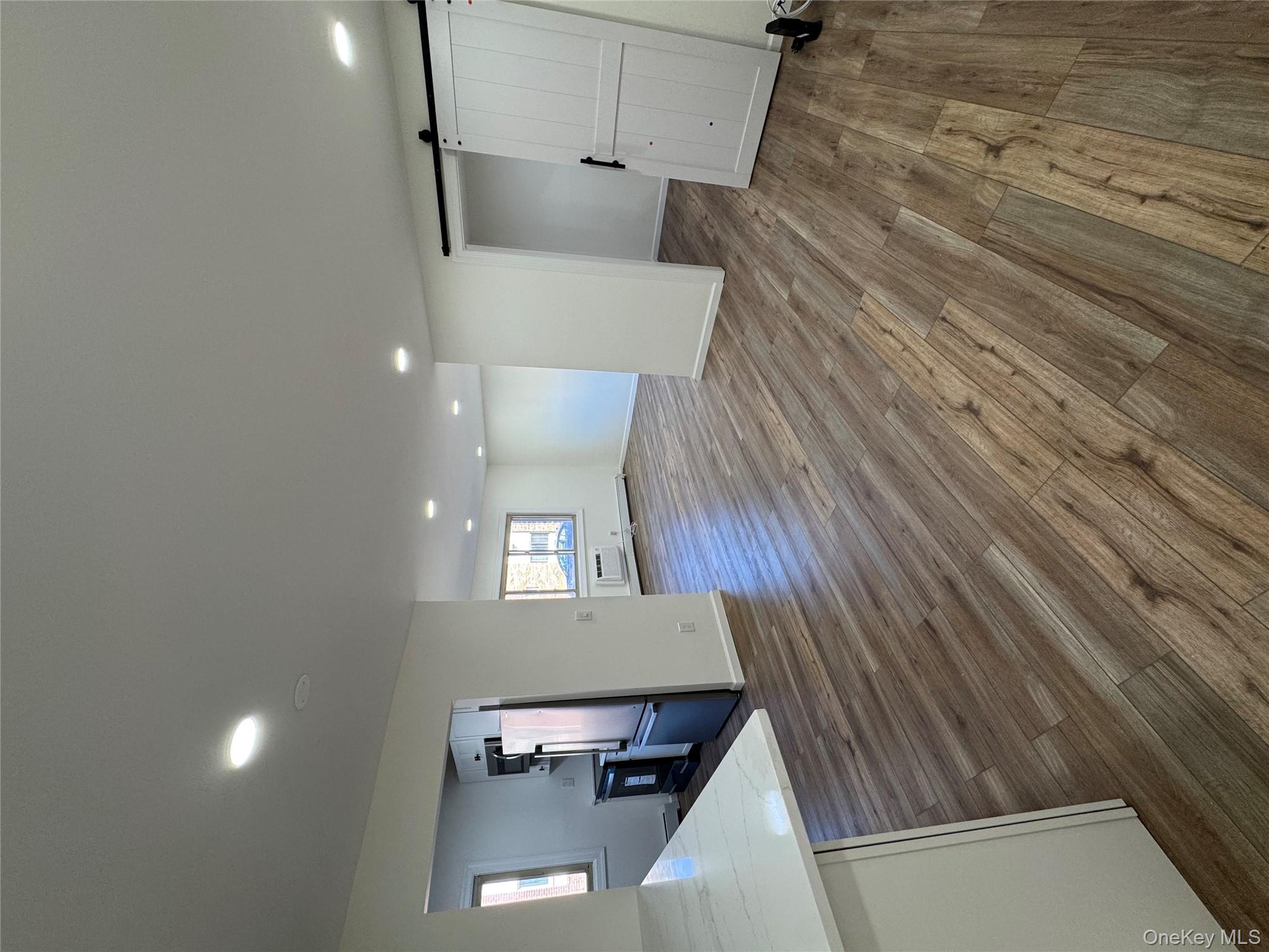 2449 I Union Avenue, Unit 34A Islip, NY 11751 - Photo 3 of 19 a view of a room with wooden floor