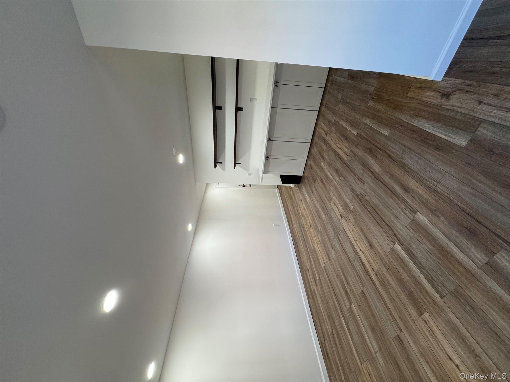 2449 I Union Avenue, Unit 34A Islip, NY 11751 - Photo 5 of 19 a view of empty room with wooden floor