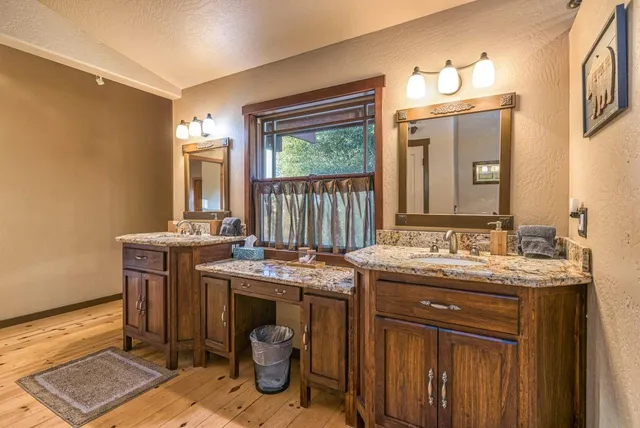 a living room with furniture a fireplace and a floor to ceiling window