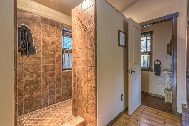 an aerial view of a house with a yard basket ball court and outdoor seating