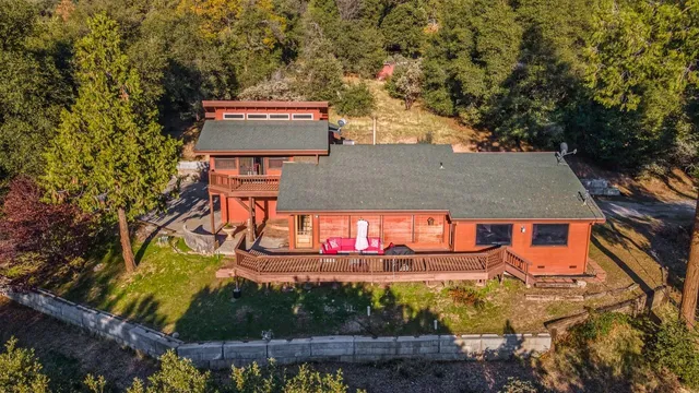 a view of balcony with wooden floor and outdoor seating