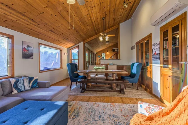 a view of a dining room with furniture window and outside view