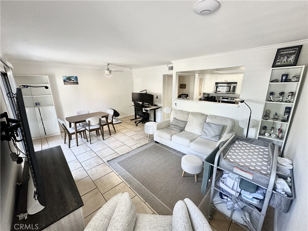 10151 Arrow, Unit 6 Rancho Cucamonga, CA 91730 - Photo 3 of 19 a living room with furniture and a flat screen tv