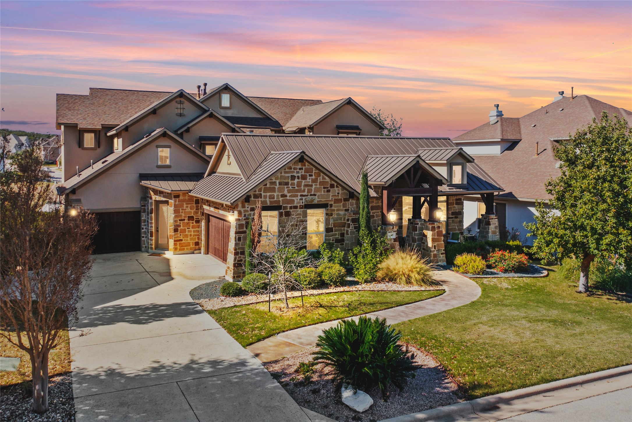 a front view of a house with garden