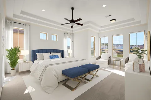 a spacious bedroom with furniture and a large window