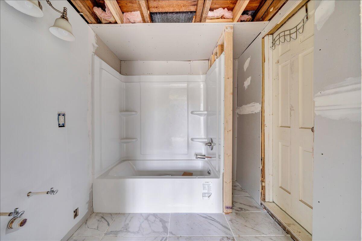 104 Claytor Road Brookneal, VA 24528 - Photo 9 of 43 a bathroom with a bathtub and a shower