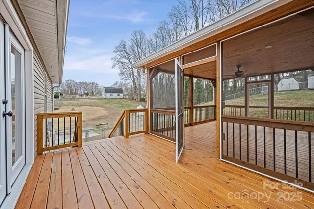 a view of a balcony with wooden floor
