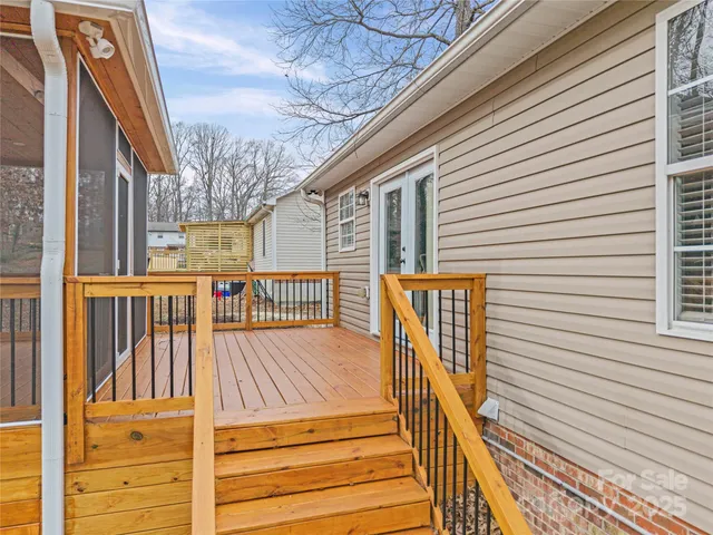 a view of balcony with wooden floor