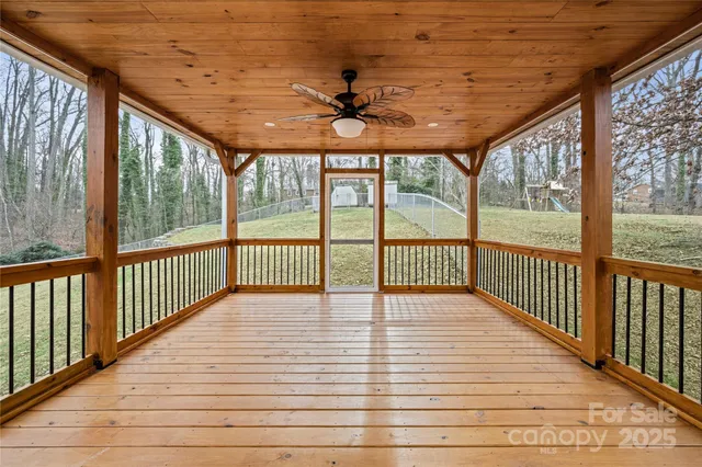 a view of a balcony with a ceiling fan