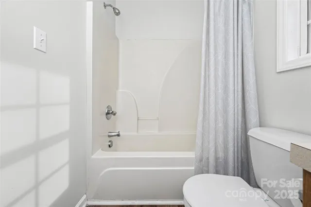 a view of an empty room with stairs