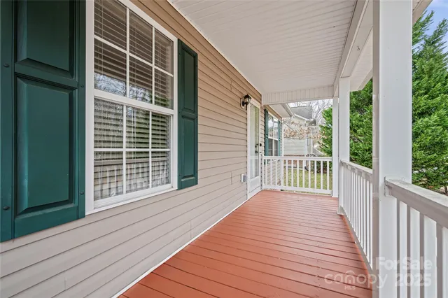 a view of a balcony with wooden floor