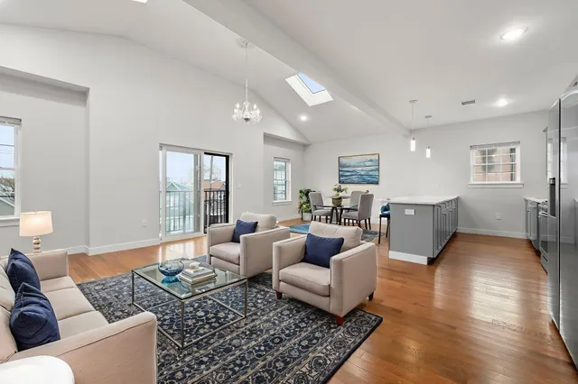 a living room with furniture or couch and a large window