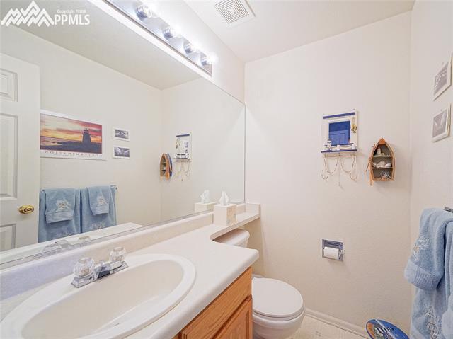 8572 Tibbs Road Peyton, CO 80831 - Photo 6 of 20 Main level half bathroom.