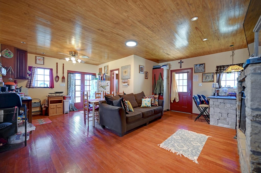 324 East Headwaters Ranch Road Kendalia, TX 78027 - Photo 31 of 61 a living room with furniture and wooden floors