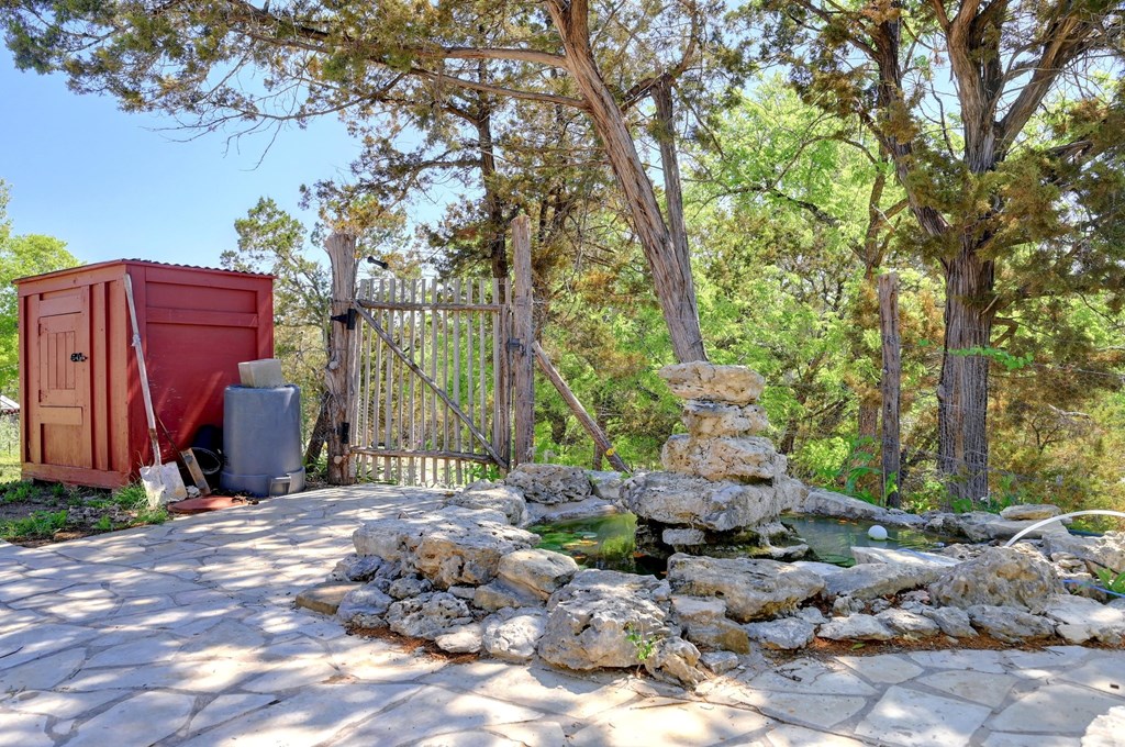 324 East Headwaters Ranch Road Kendalia, TX 78027 - Photo 45 of 61 a backyard of a house with lots of green space