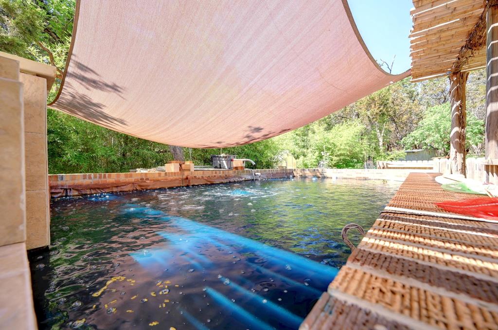 324 East Headwaters Ranch Road Kendalia, TX 78027 - Photo 53 of 61 a view of a swimming pool with a patio