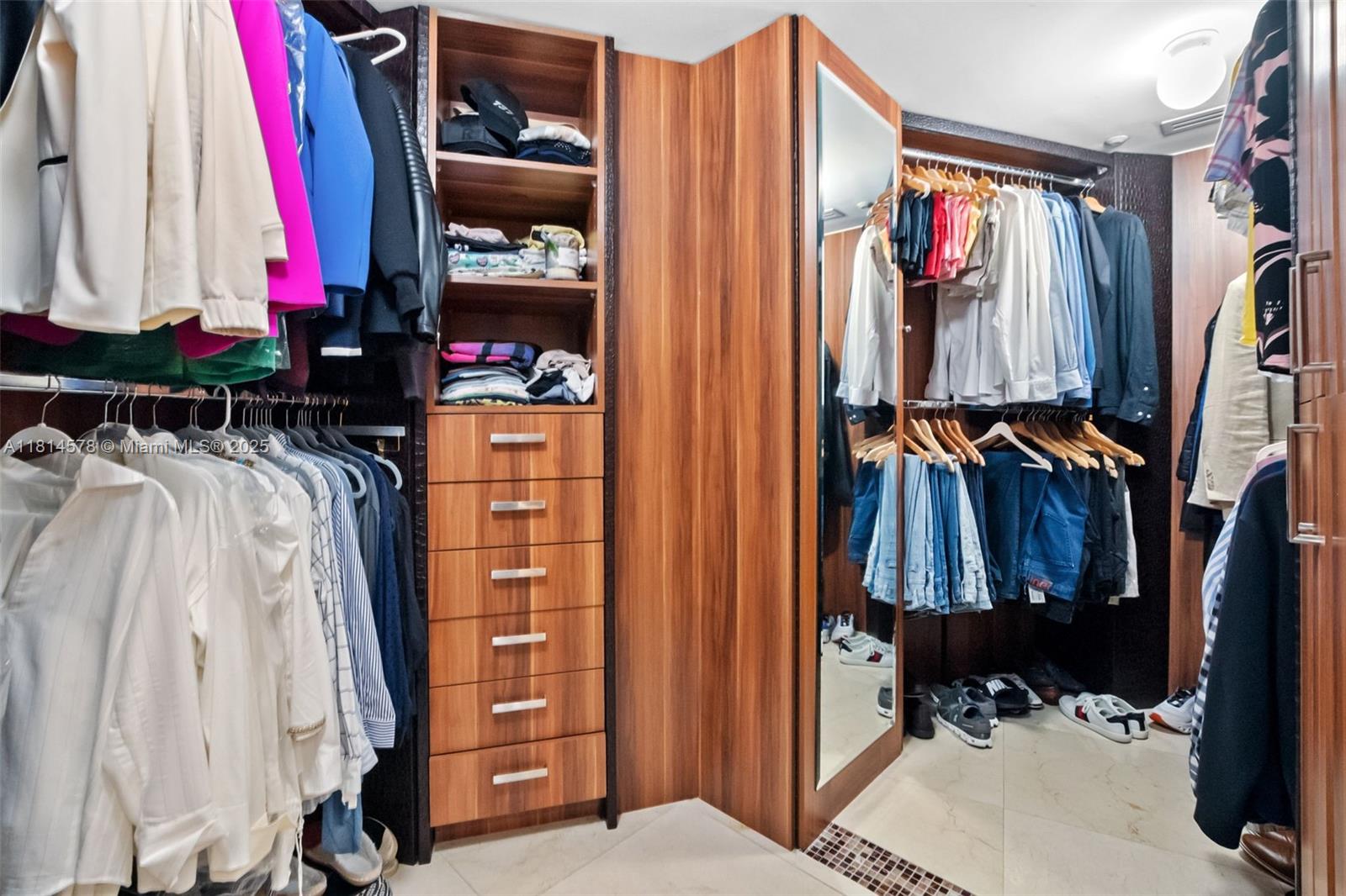 18911 Collins Avenue, Unit 706 Sunny Isles Beach, FL 33160 - Photo 20 of 28 a view of walk in closet with clothes and shoes