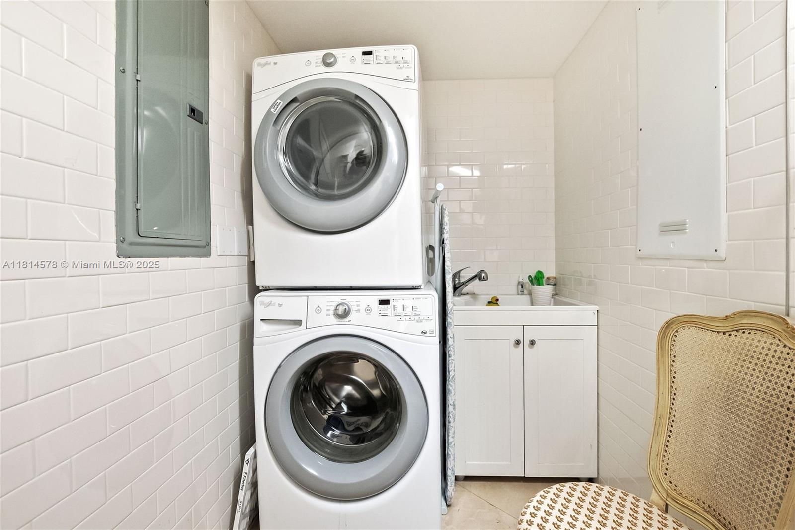 18911 Collins Avenue, Unit 706 Sunny Isles Beach, FL 33160 - Photo 26 of 28 a utility room with dryer and washer