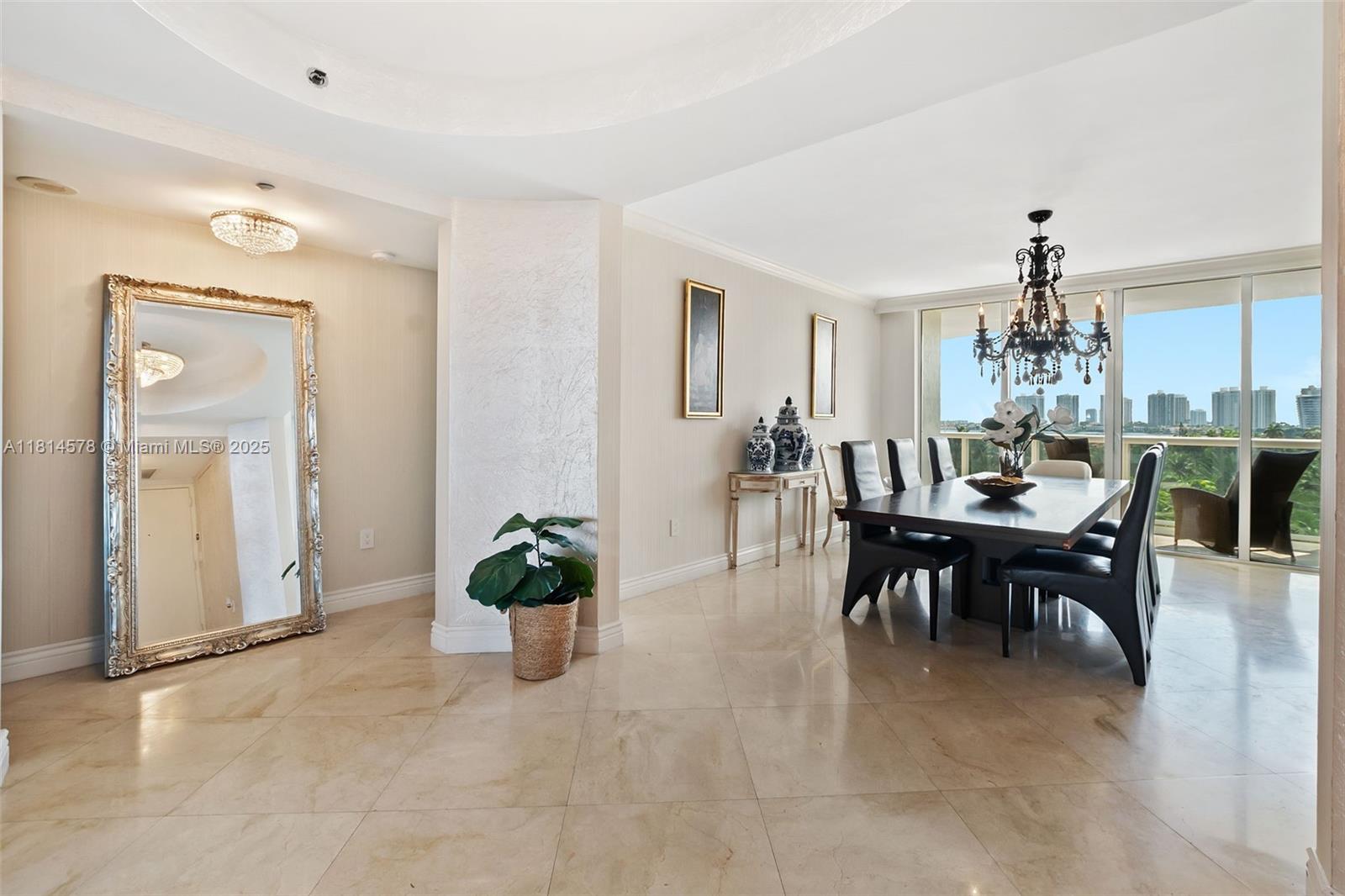 18911 Collins Avenue, Unit 706 Sunny Isles Beach, FL 33160 - Photo 6 of 28 a dining room with furniture and window