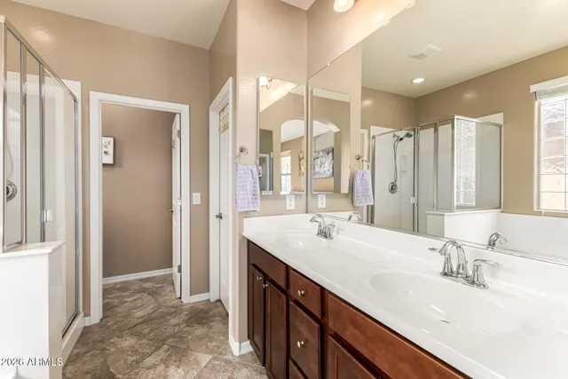 a bathroom with a double vanity sink mirror and double