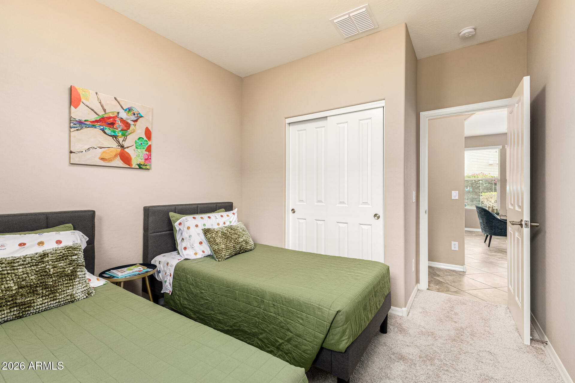 20594 West White Rock Road Buckeye, AZ 85396 - Photo 20 of 38 a bedroom with two beds and a painting on the wall