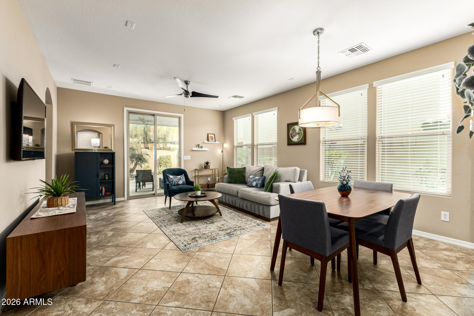 20594 West White Rock Road Buckeye, AZ 85396 - Photo 2 of 38 a living room with furniture and large windows