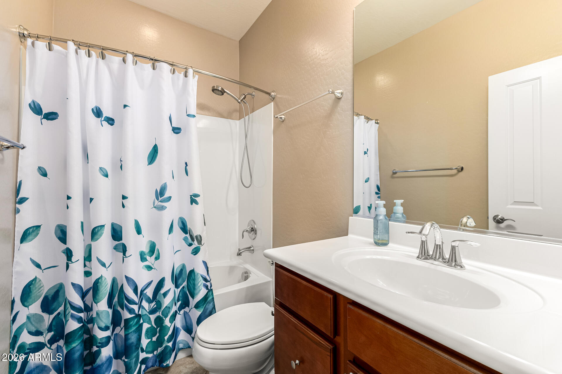 20594 West White Rock Road Buckeye, AZ 85396 - Photo 21 of 38 a bathroom with a sink toilet and shower