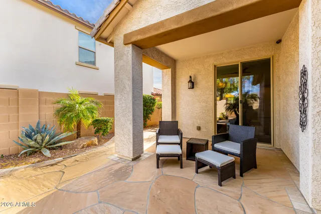 a living room with patio furniture