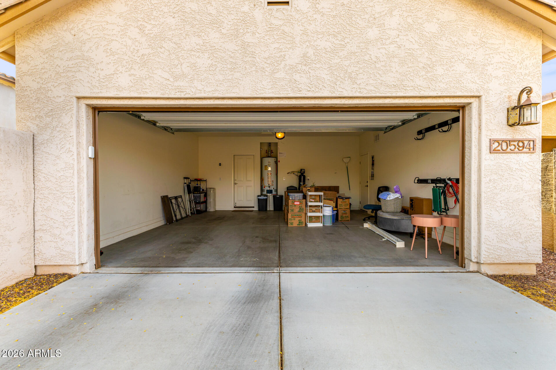20594 West White Rock Road Buckeye, AZ 85396 - Photo 28 of 38 a living room with furniture and a potted plant